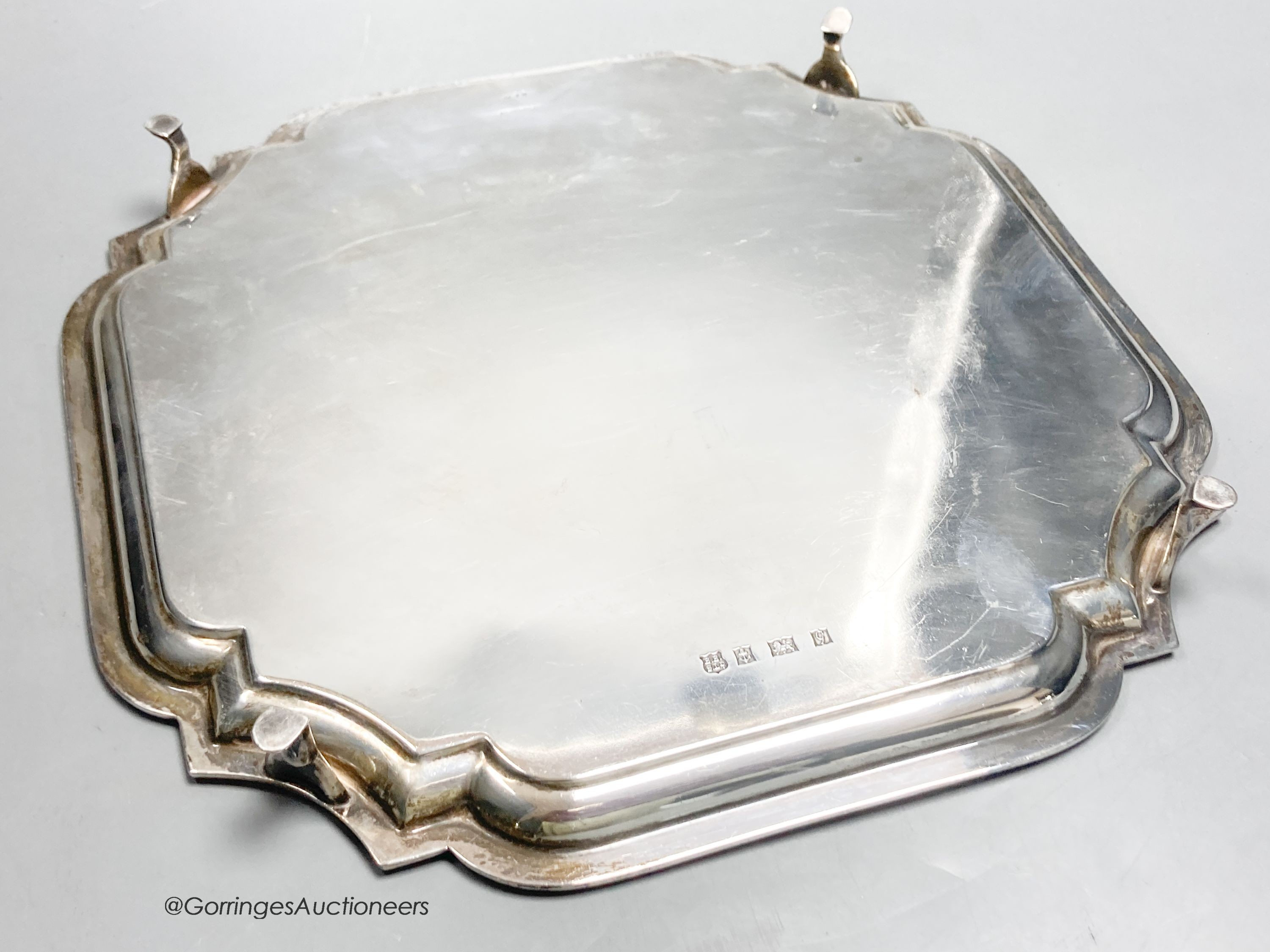 A square silver waiter with piecrust border, inscribed, Birmingham 1956, 25.9cm, with engraved inscription, 25oz.